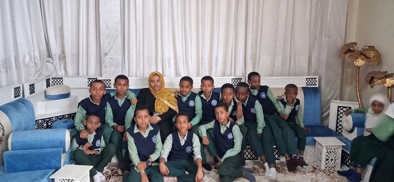 Teacher with students in an indoor gathering
